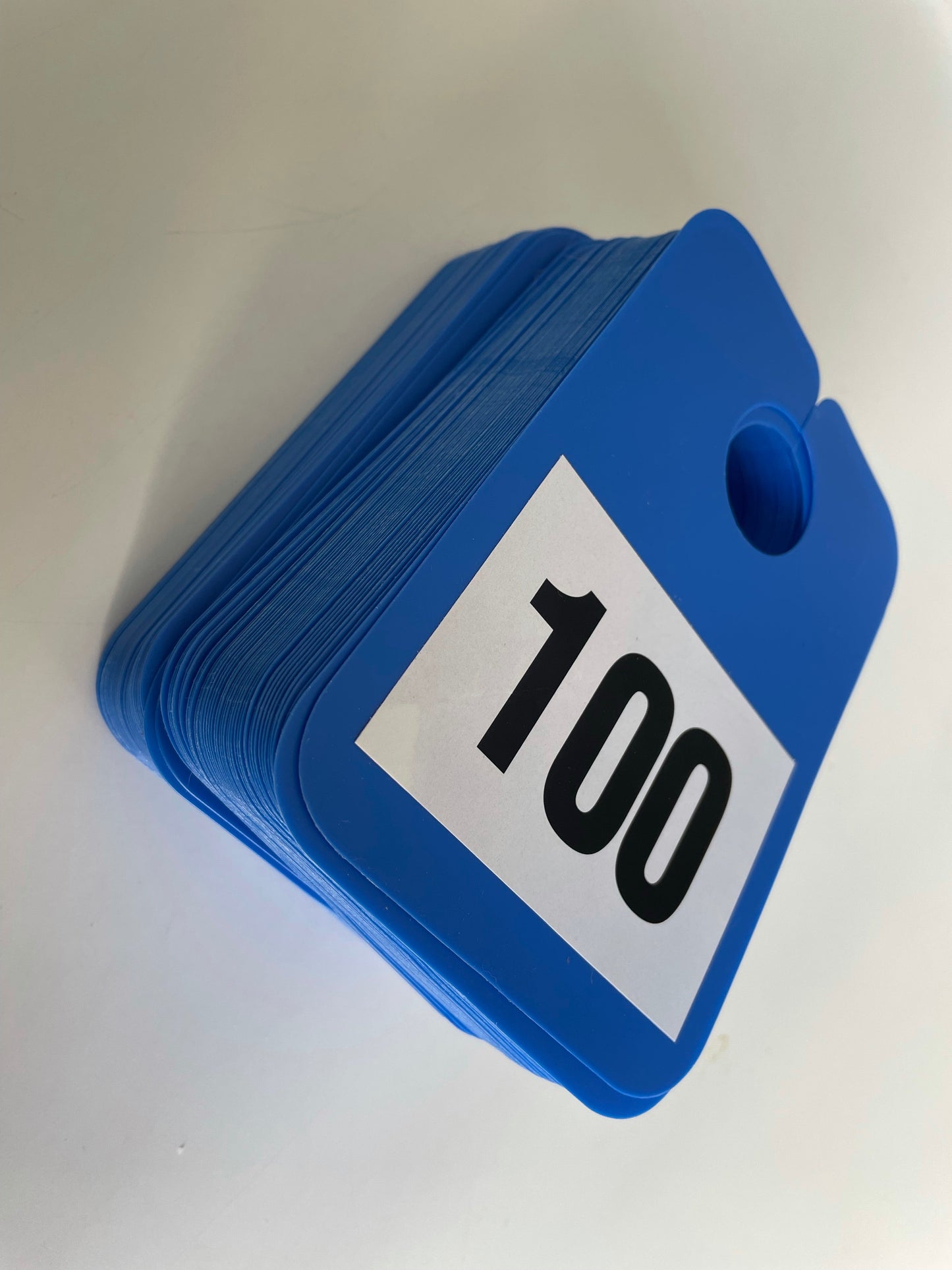 Numbered Mirror Hangers - Image of numbers 1 to 100 on blue hangers