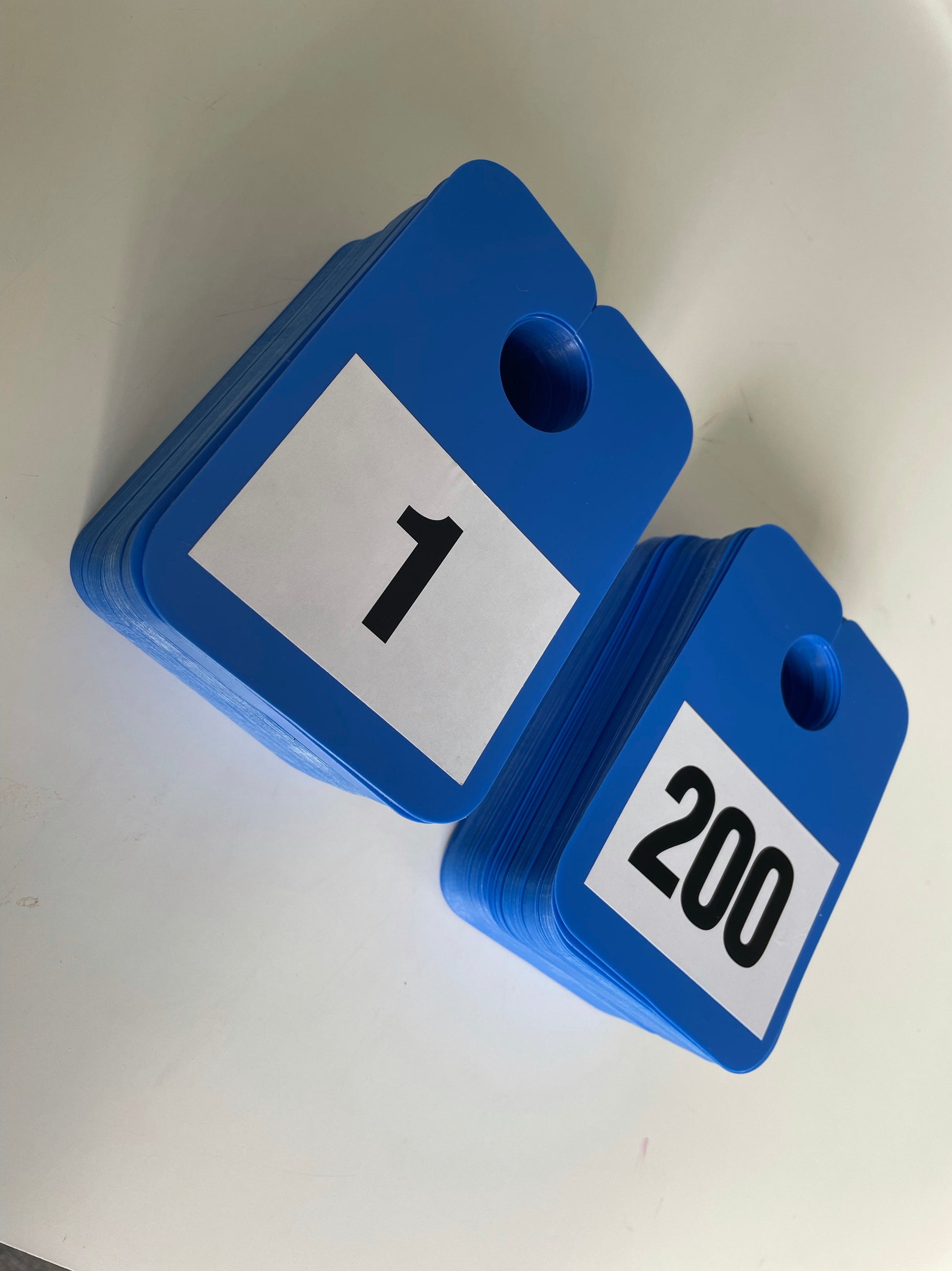 Numbered Mirror Hangers - Image of numbers 1 to 200 on blue hangers